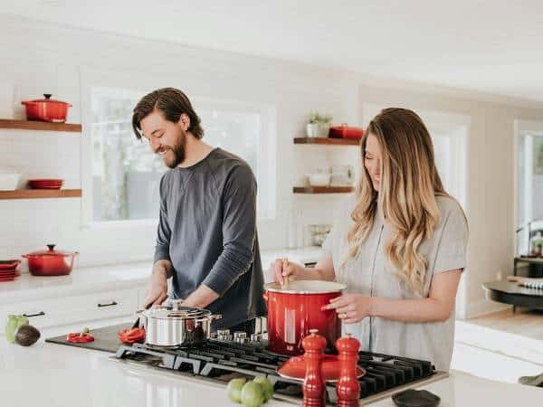 Houses for Rent in Bulgaria 9 A couple cook together inside a home they're renting.