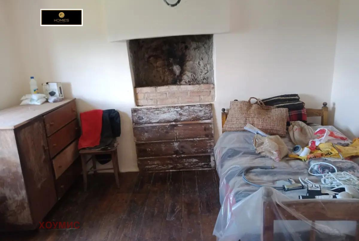 Bedroom with bed and fireplace in earthy tones