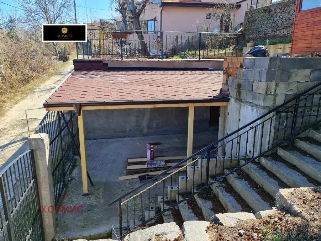 Covered parking with red ceramic tile roof