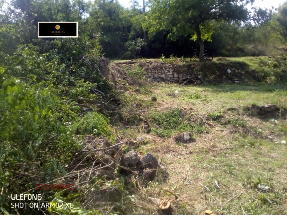 Rural land plot with old house ruins