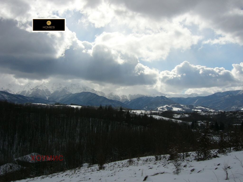 Stone buildings in snowy mountainous terrain area