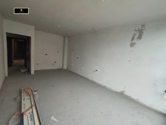 Spacious living room with white walls concrete floor