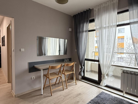 Modern living area with work desk and natural light