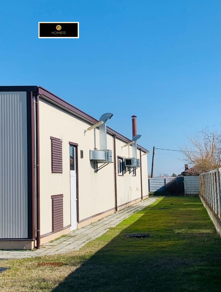 Cream colored industrial facility with burgundy accents outside