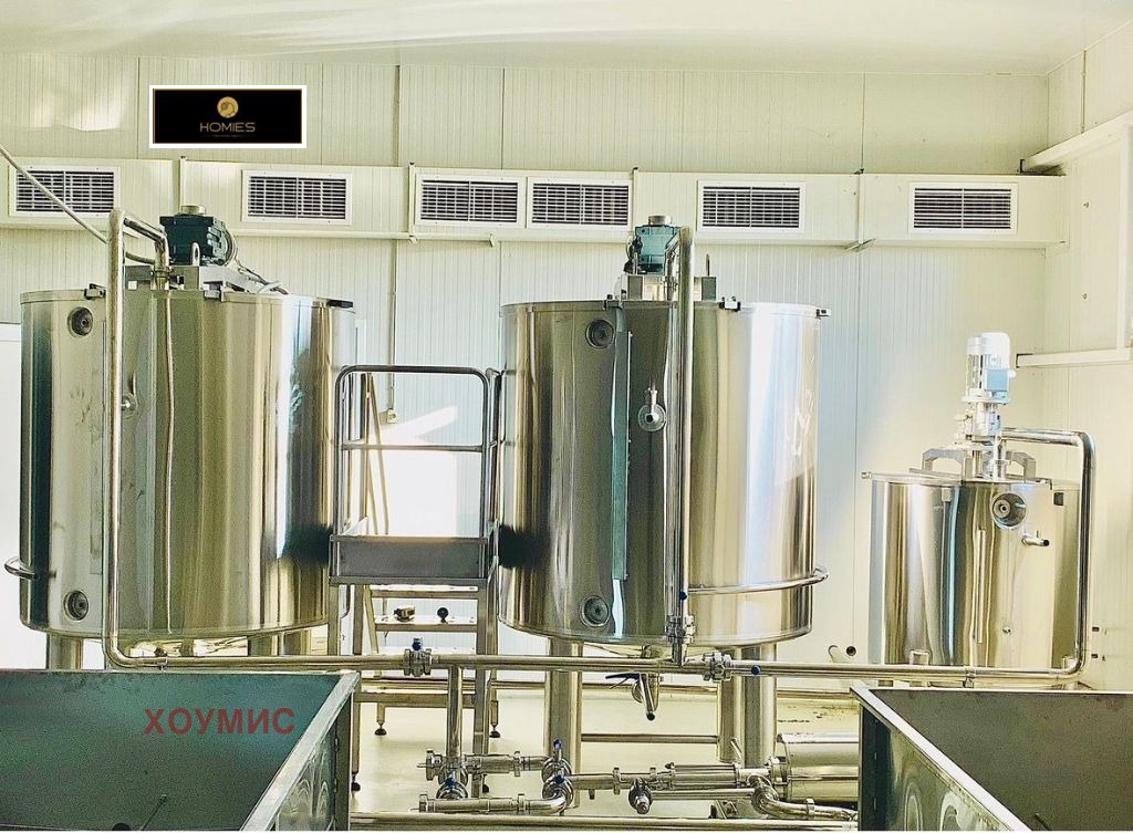 Large metal storage tanks for honey processing and production