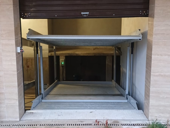 Garage with automatic roller shutter door open