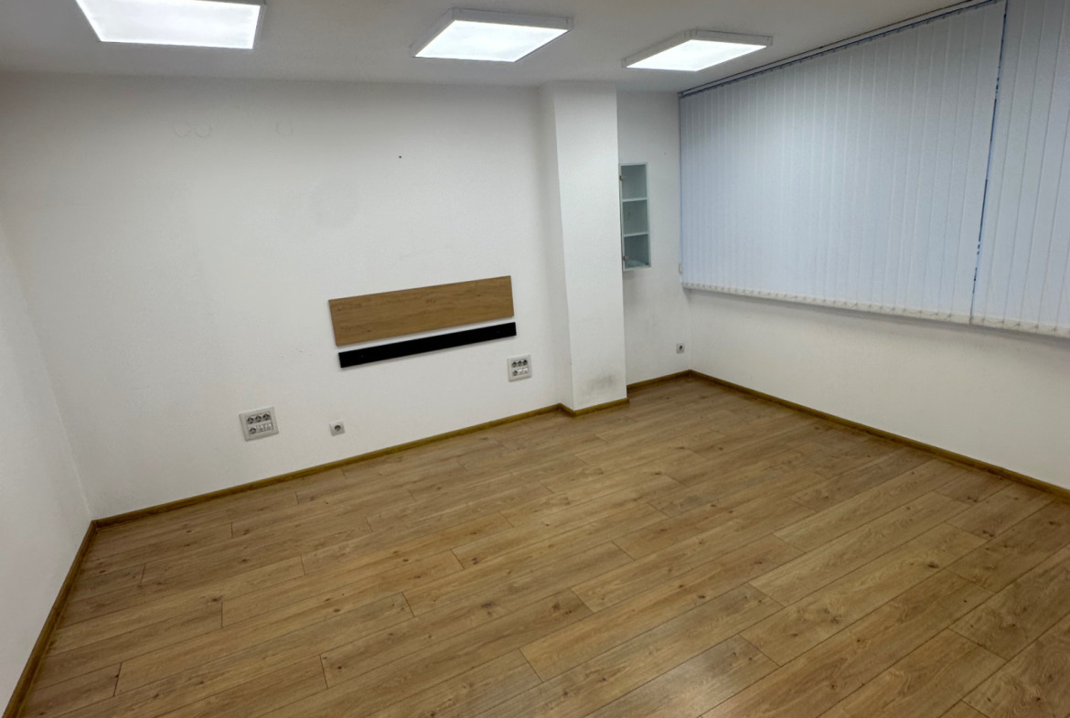 Modern bright office space with wood flooring
