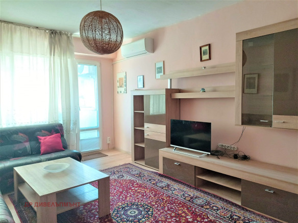 Bright living room with pink walls and modern furniture