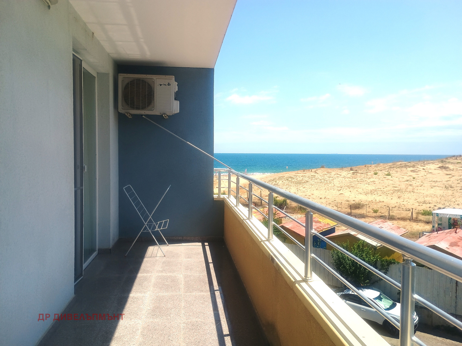 Balcony with sea view and air conditioning unit