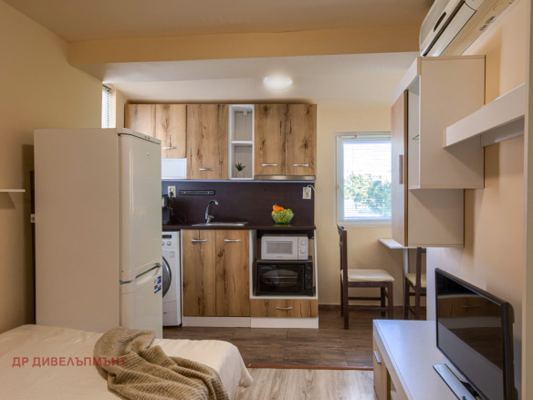 Studio apartment with integrated kitchen and sleeping area