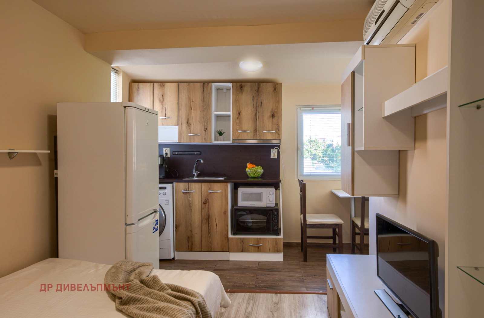 Studio apartment with integrated kitchen and sleeping area