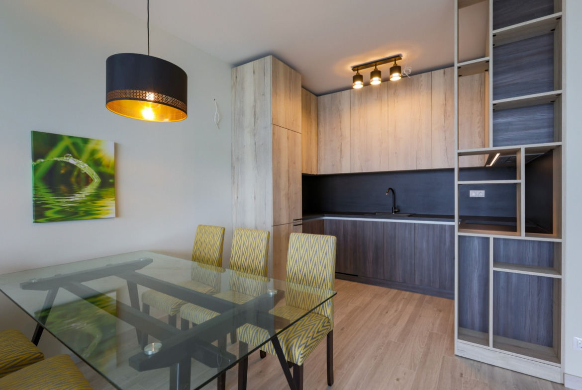 Modern kitchen with bar and yellow chairs