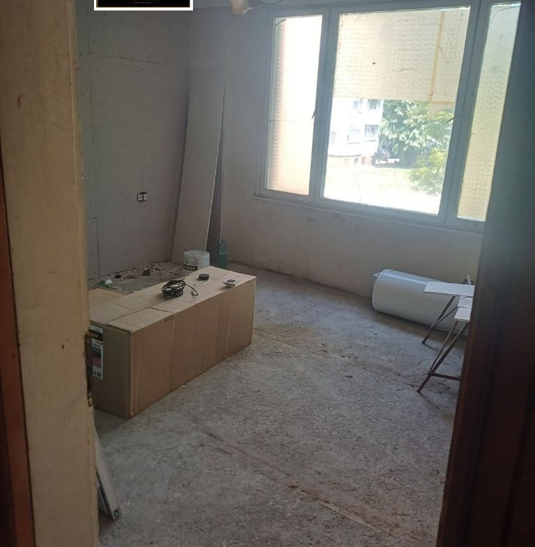 Kitchen under renovation with fixtures and plumbing