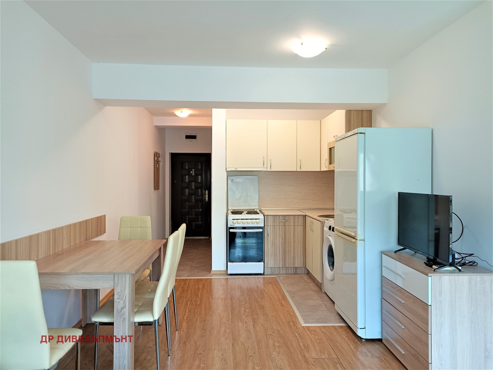 Modern kitchen with white cabinets and dining area