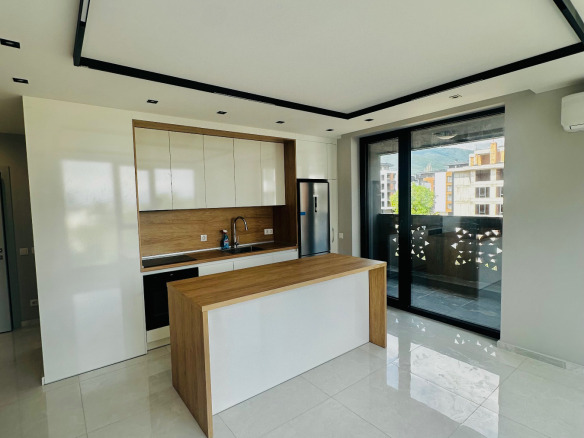 Two-Bedroom Apartment 97 sqm for Sale in Krastova Vada | Vitosha View 5 Modern kitchen with island and white cabinets