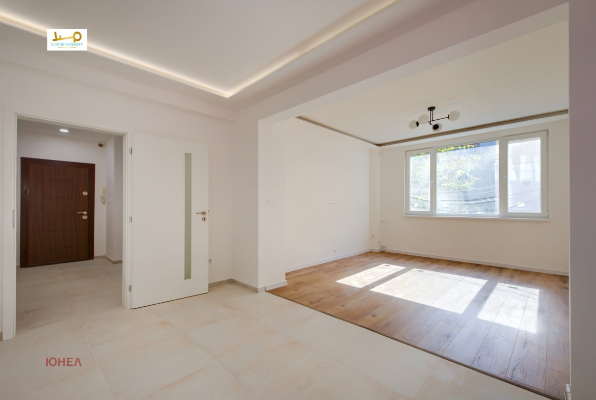 Two-Bedroom Apartment in Sofia, open living area, wood and tile floors