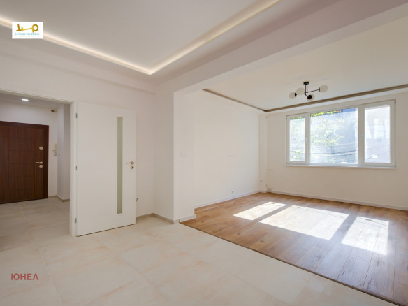 Two-Bedroom Apartment in Sofia, open living area, wood and tile floors