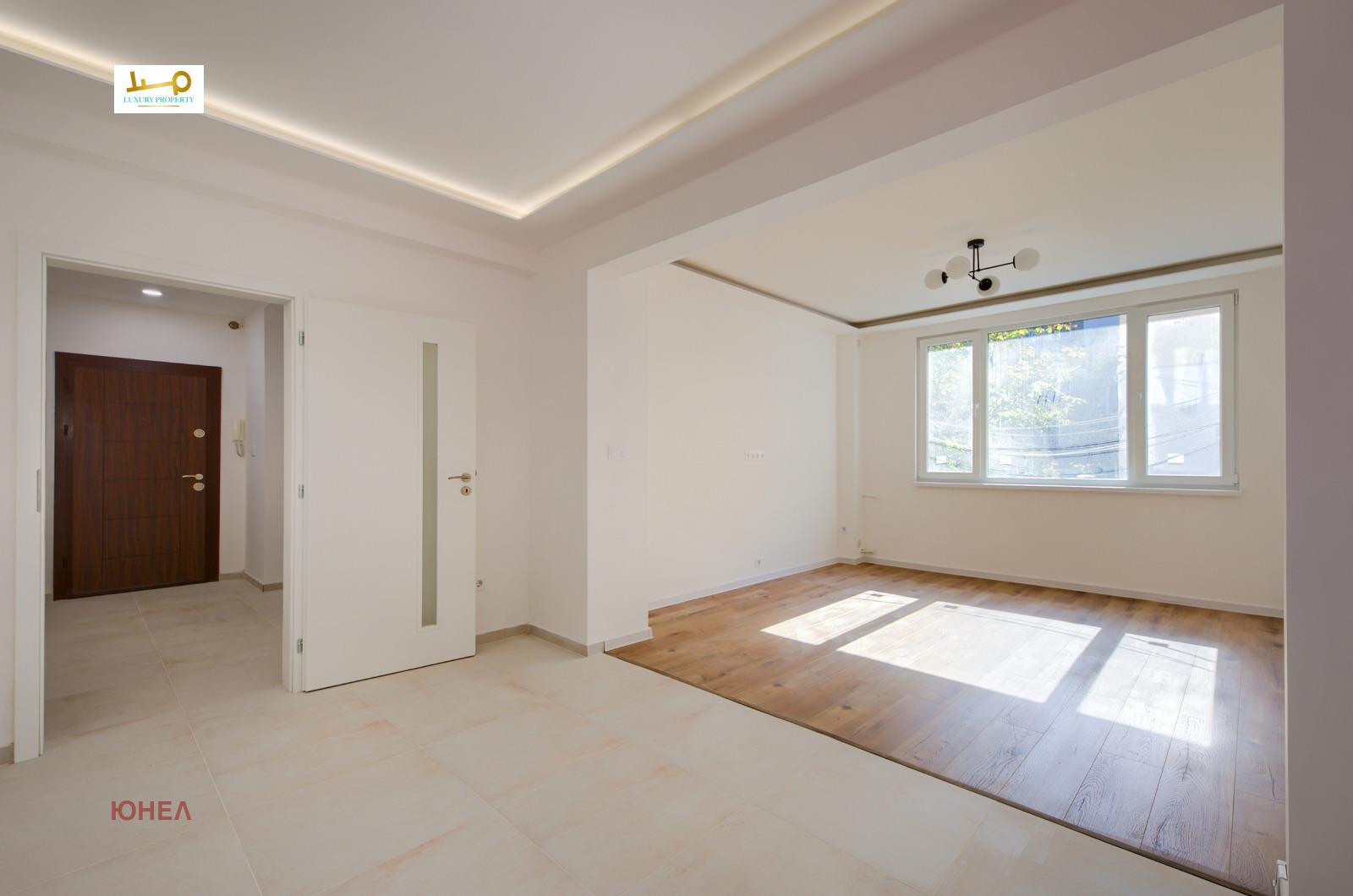 Two-Bedroom Apartment in Sofia, open living area, wood and tile floors