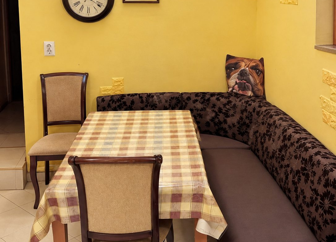Yellow dining room with table and chairs