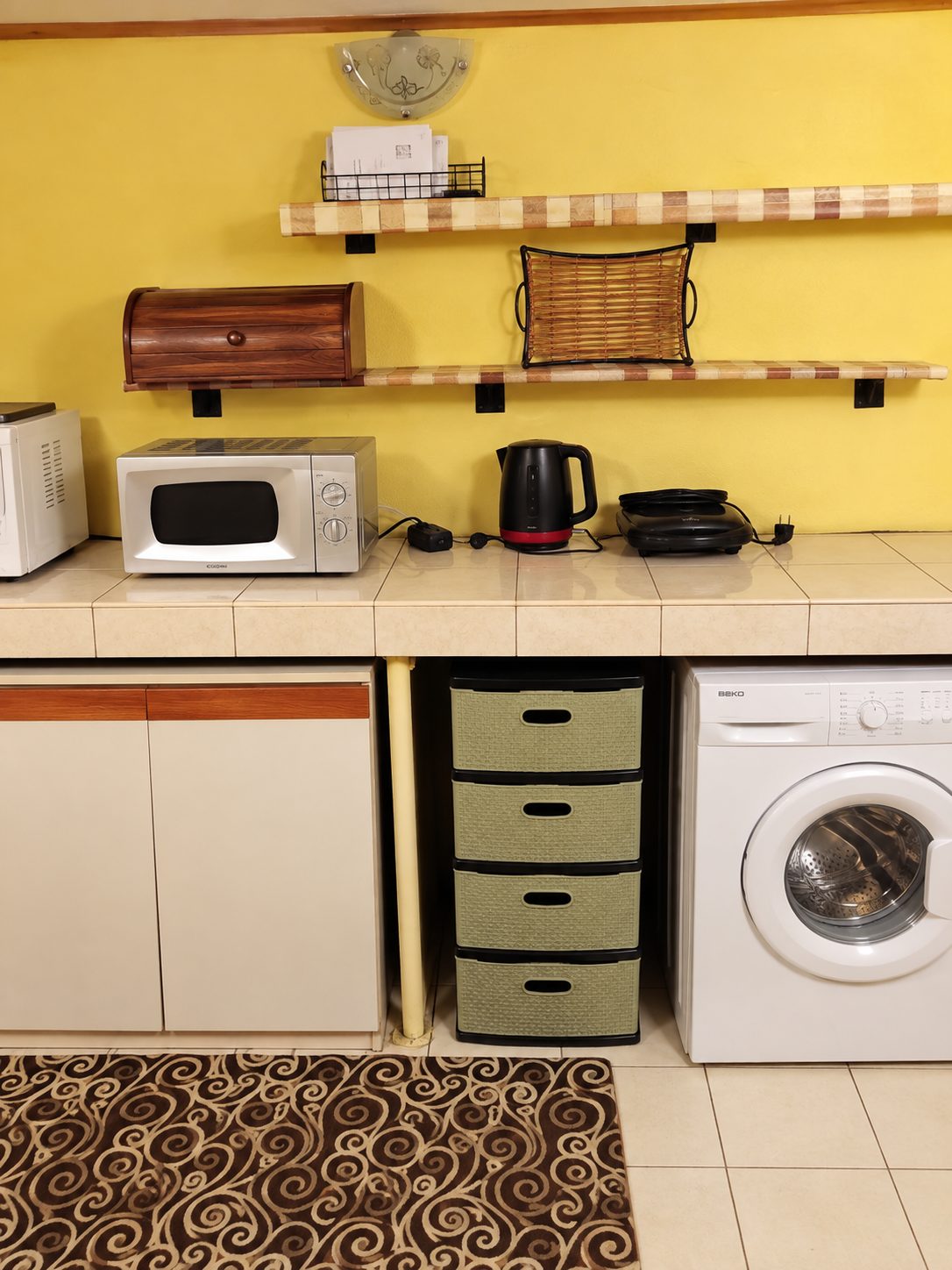 Kitchen with yellow walls and white appliances