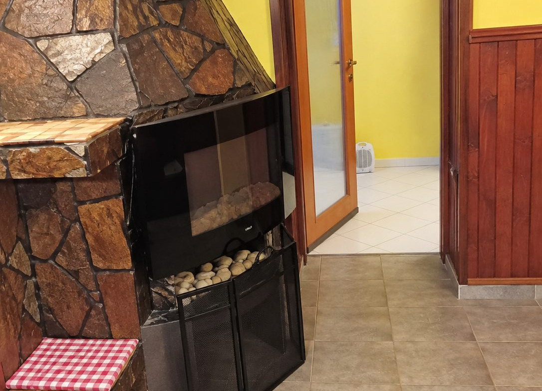 Fireplace with stove and yellow walls