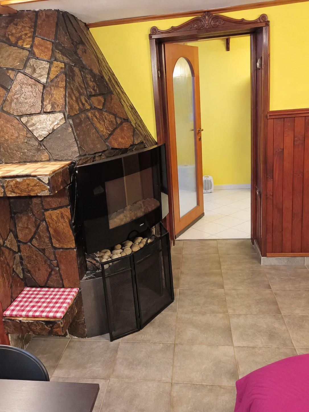 Fireplace with stove and yellow walls
