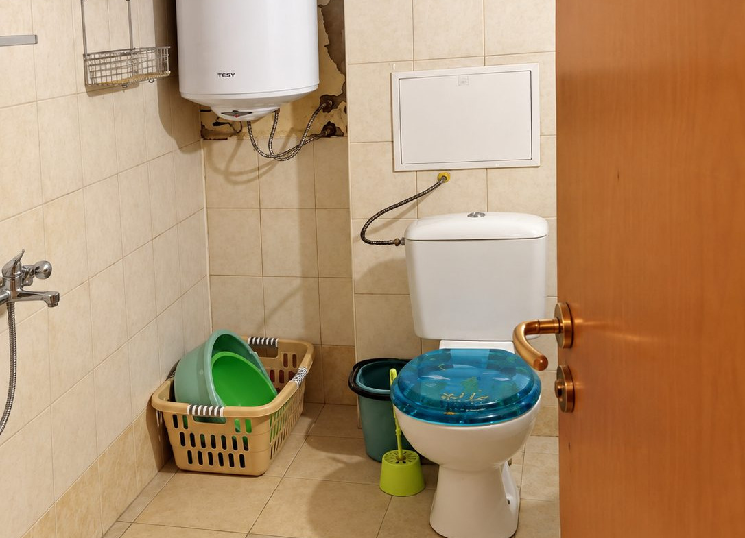 Bathroom with toilet and water heater
