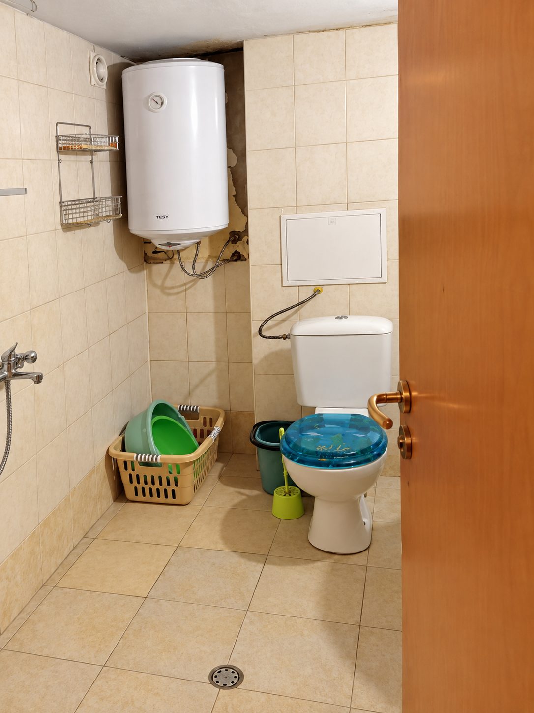 Bathroom with toilet and water heater