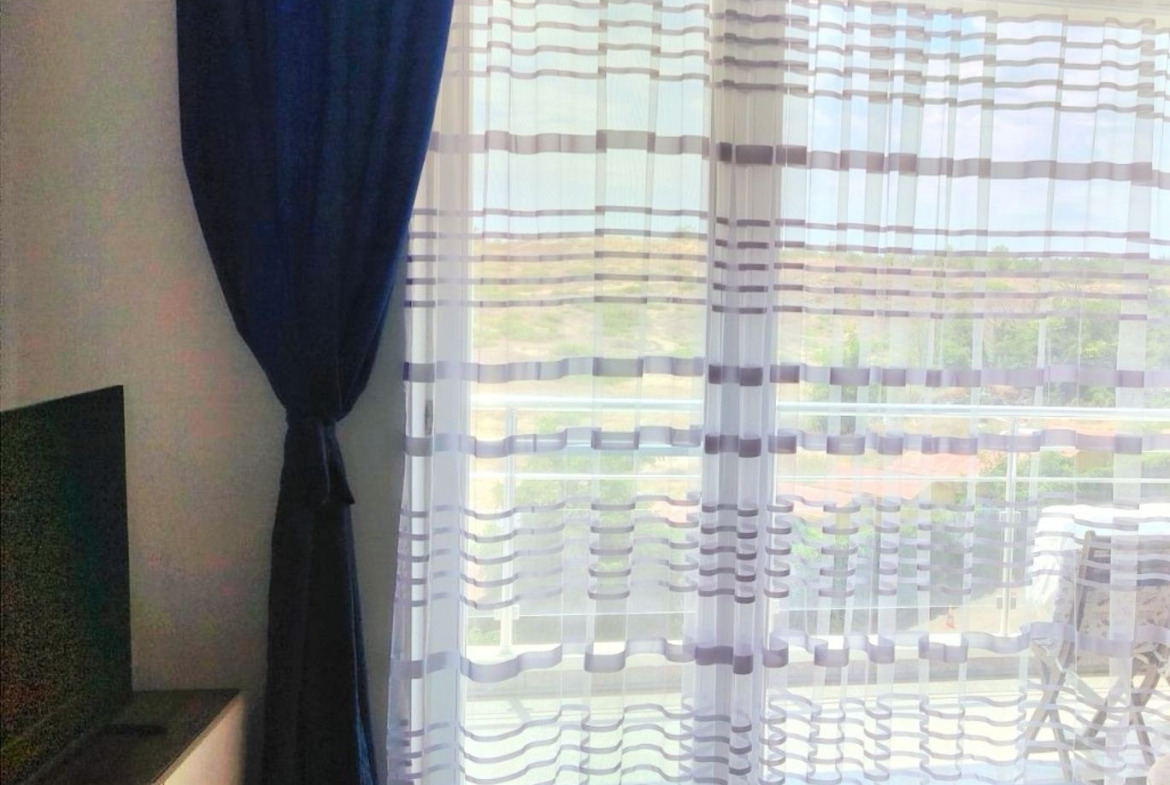 dvustaen-apartament-71-sqm-pod-naem-nesebar-kristal-biych-5 Window with dark curtains and panoramic sea view
