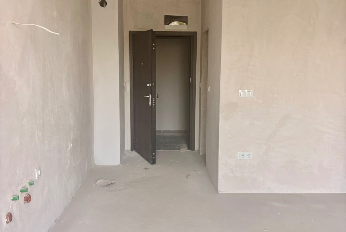 Apartment entrance corridor with door and wiring