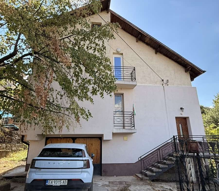 Modern house with garage and metal railings