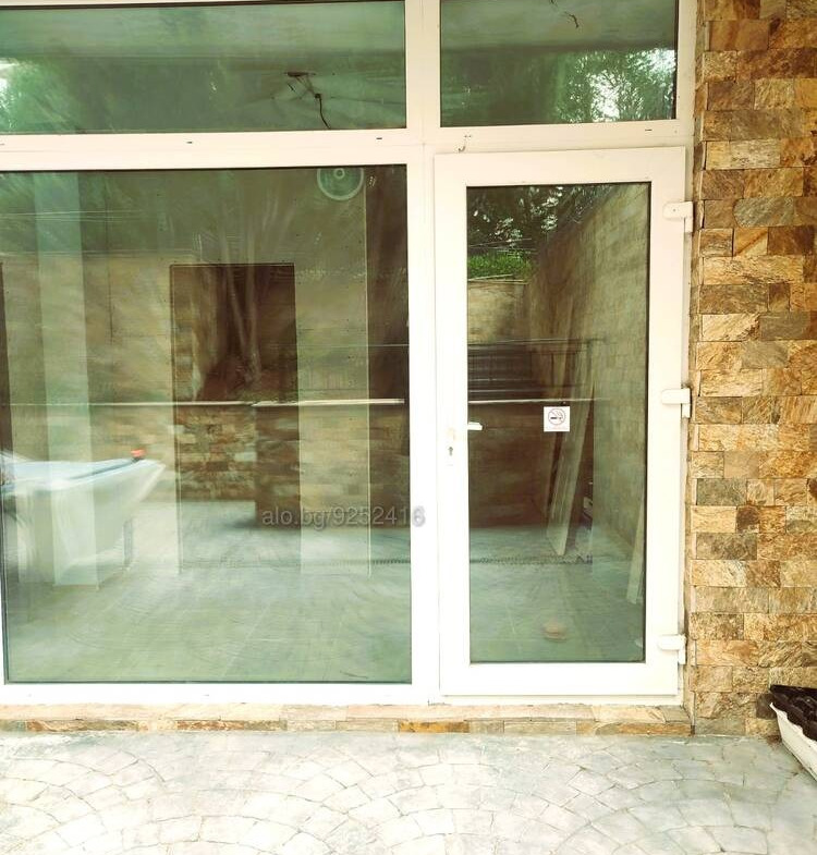 Shop storefront with double doors and glass windows