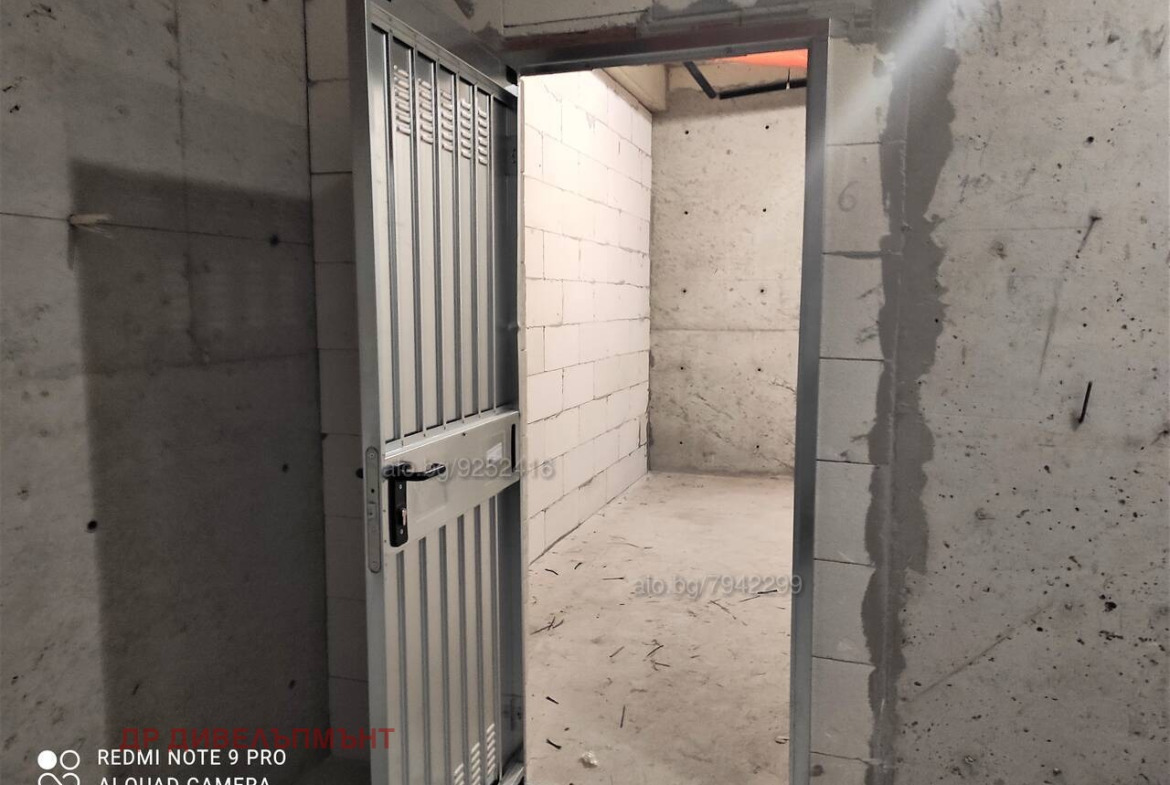 Empty warehouse with concrete walls and entrance