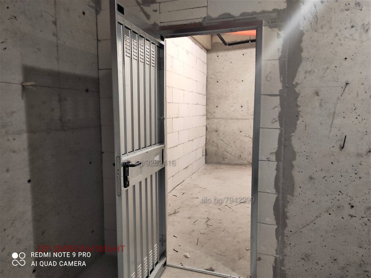 Empty warehouse with concrete walls and entrance