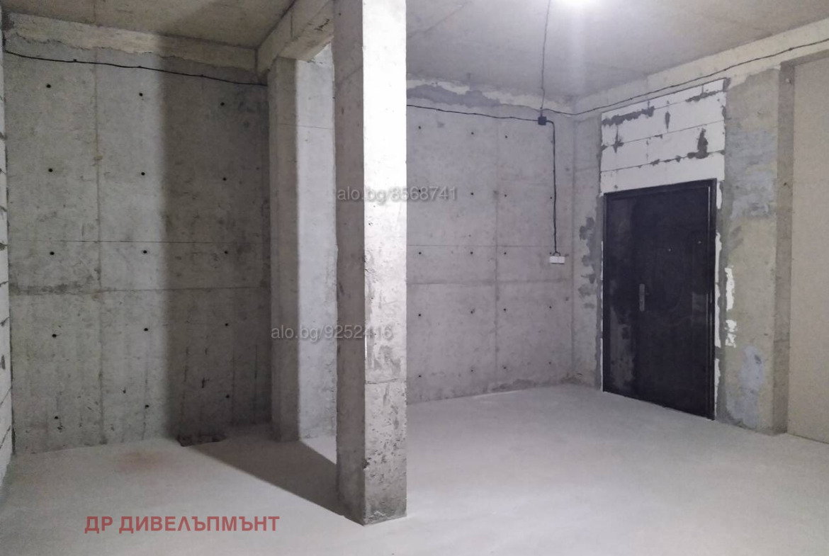 Open door to unfinished garage storage space