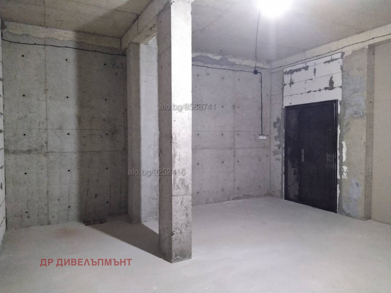 Open door to unfinished garage storage space