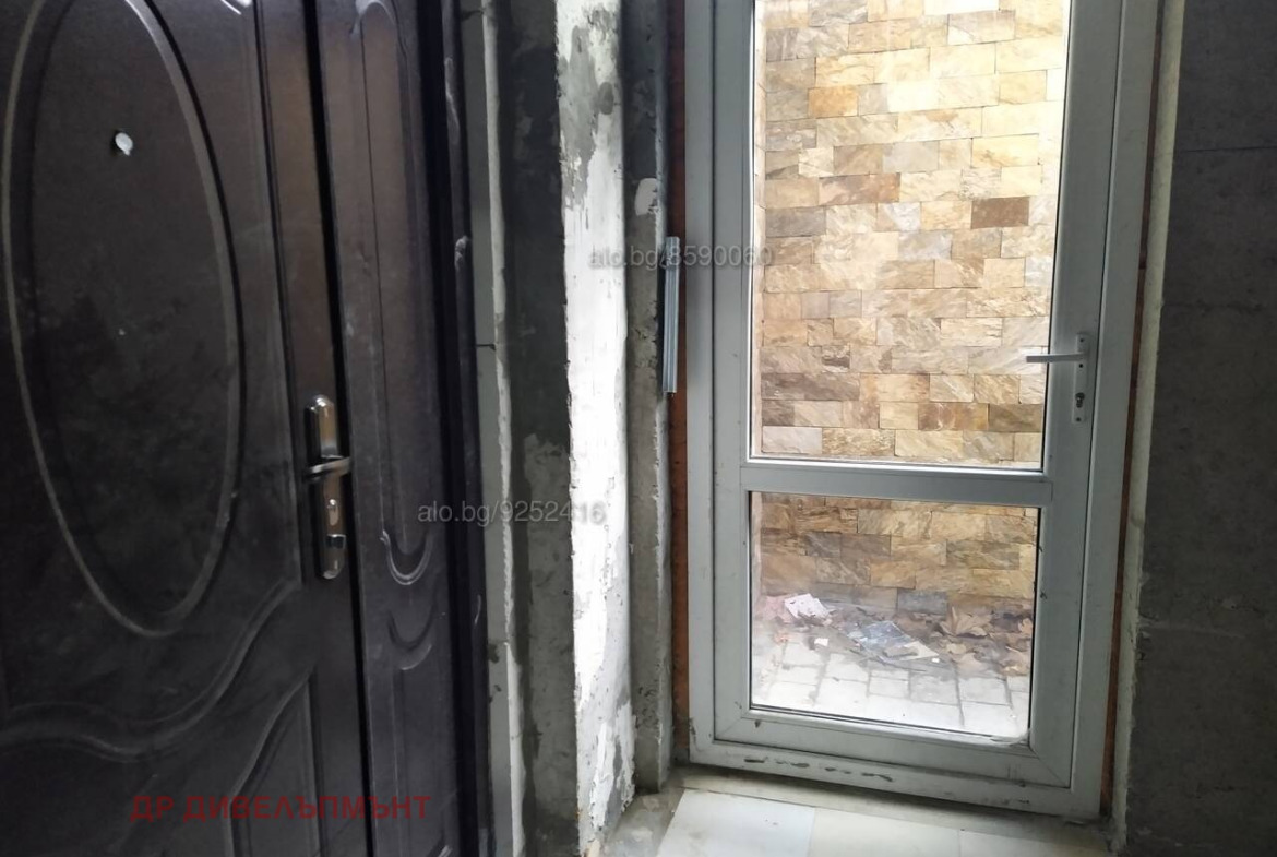 Black security door with sink inside warehouse