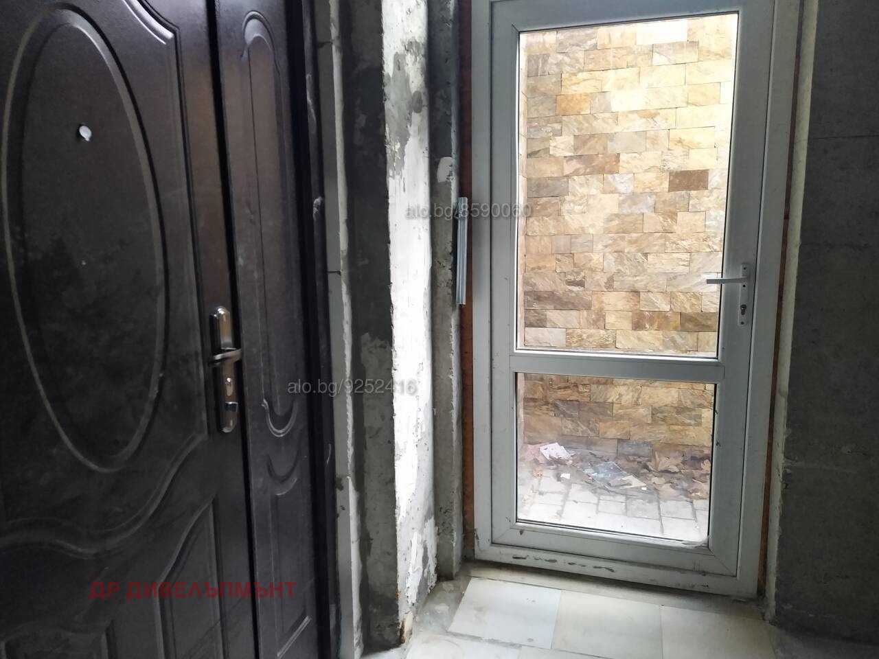 Black security door with sink inside warehouse