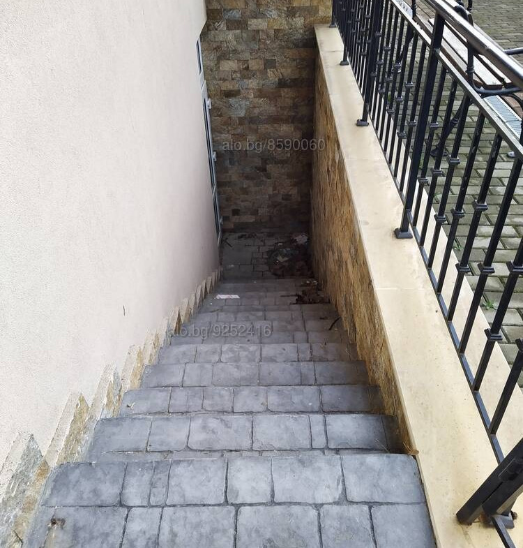 Metal handrail stairs leading to residential building