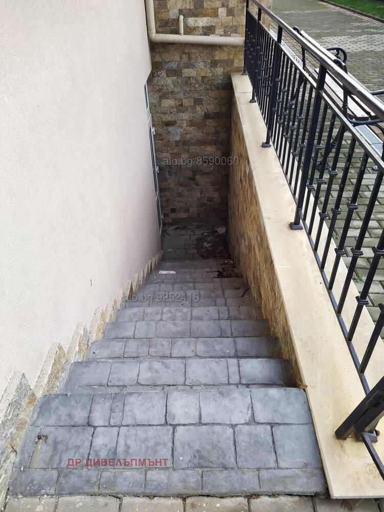 Metal handrail stairs leading to residential building