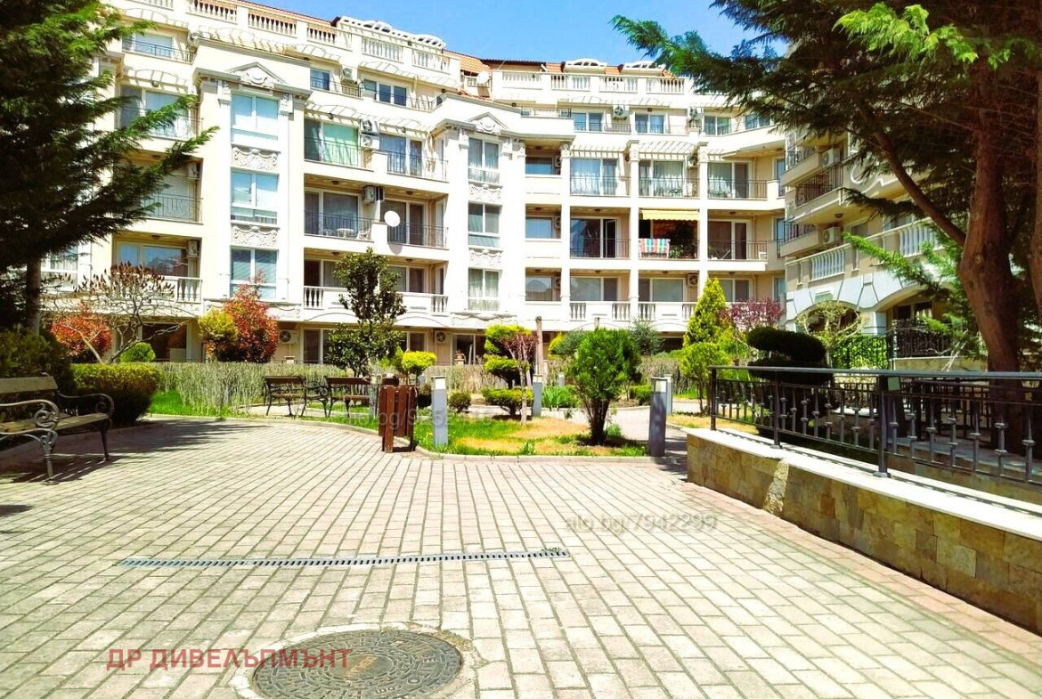 Courtyard with landscaping and multi-story apartment building
