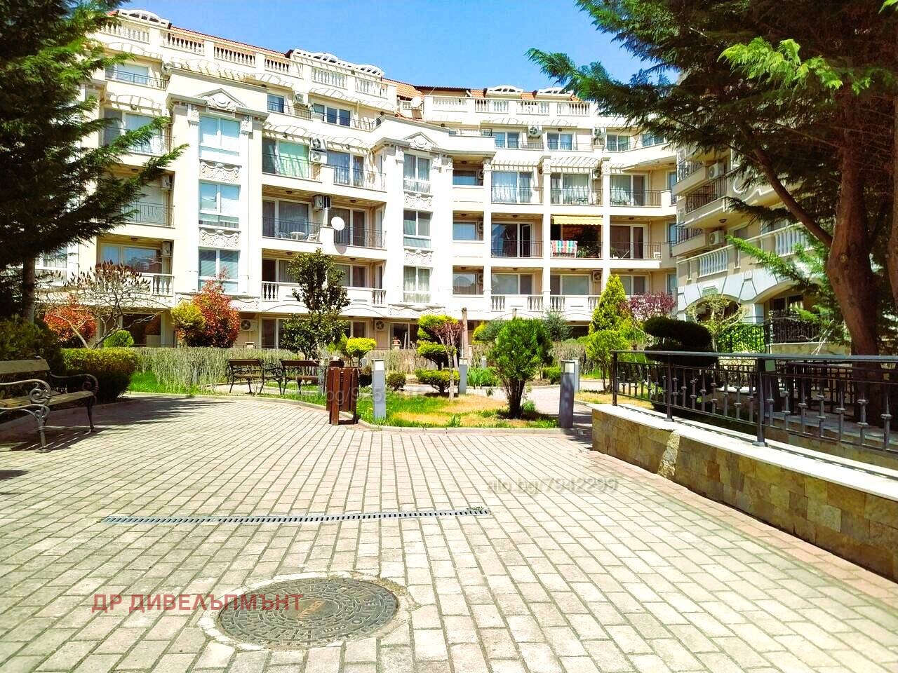 Courtyard with landscaping and multi-story apartment building