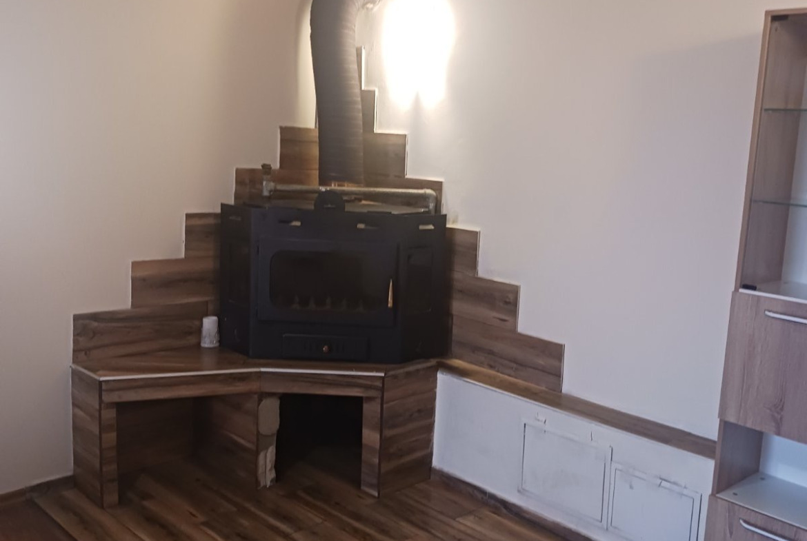 Fireplace with wooden furniture in living room