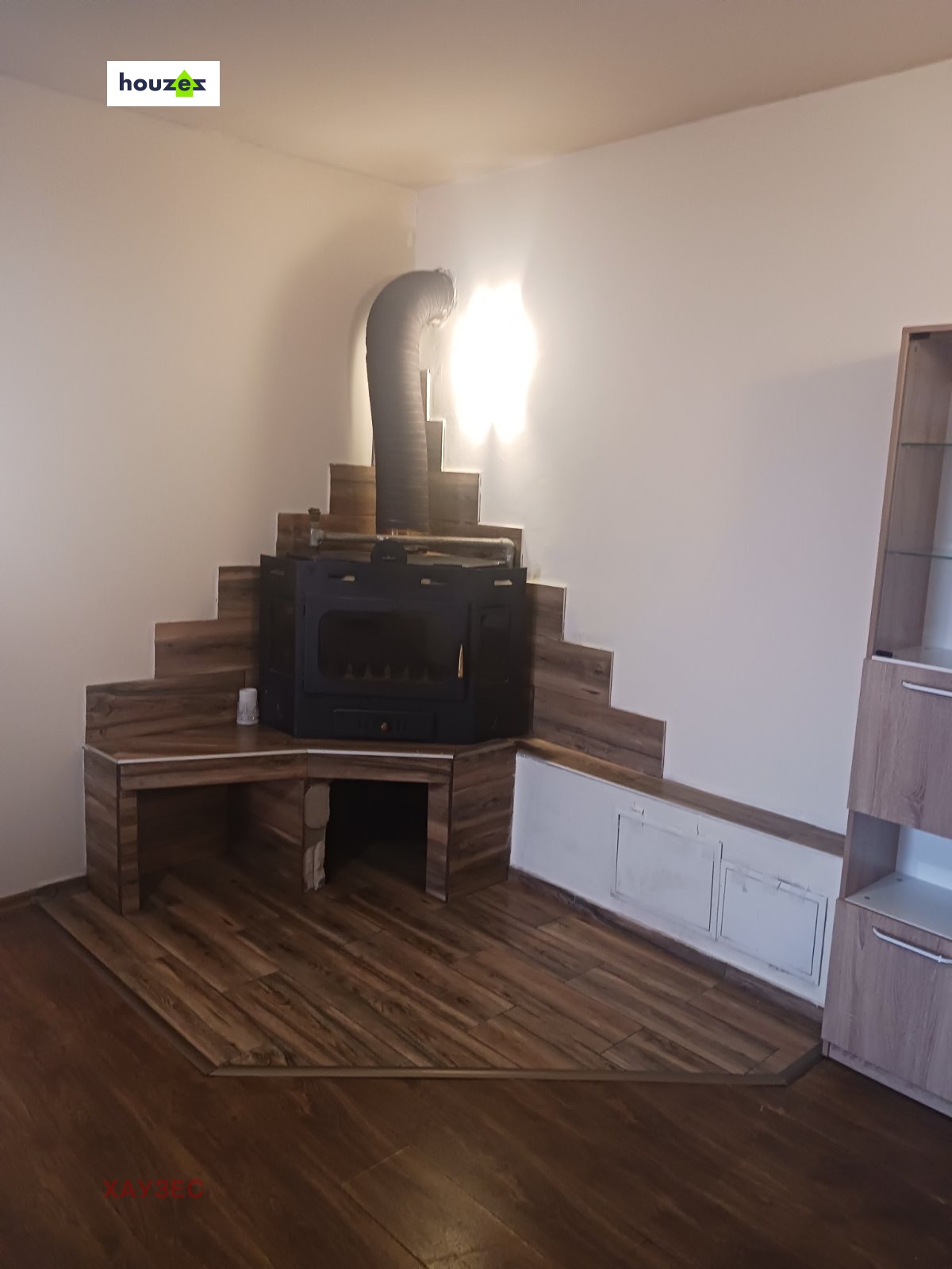 Fireplace with wooden furniture in living room