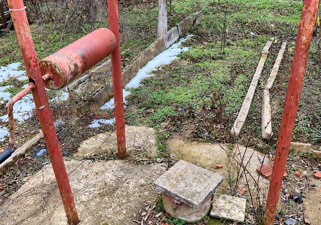 Villa in vineyard with red water pump system