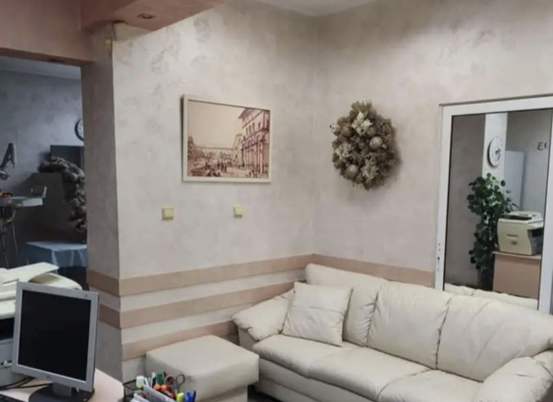 Commercial Property Sofia reception area with white leather sofa and desk
