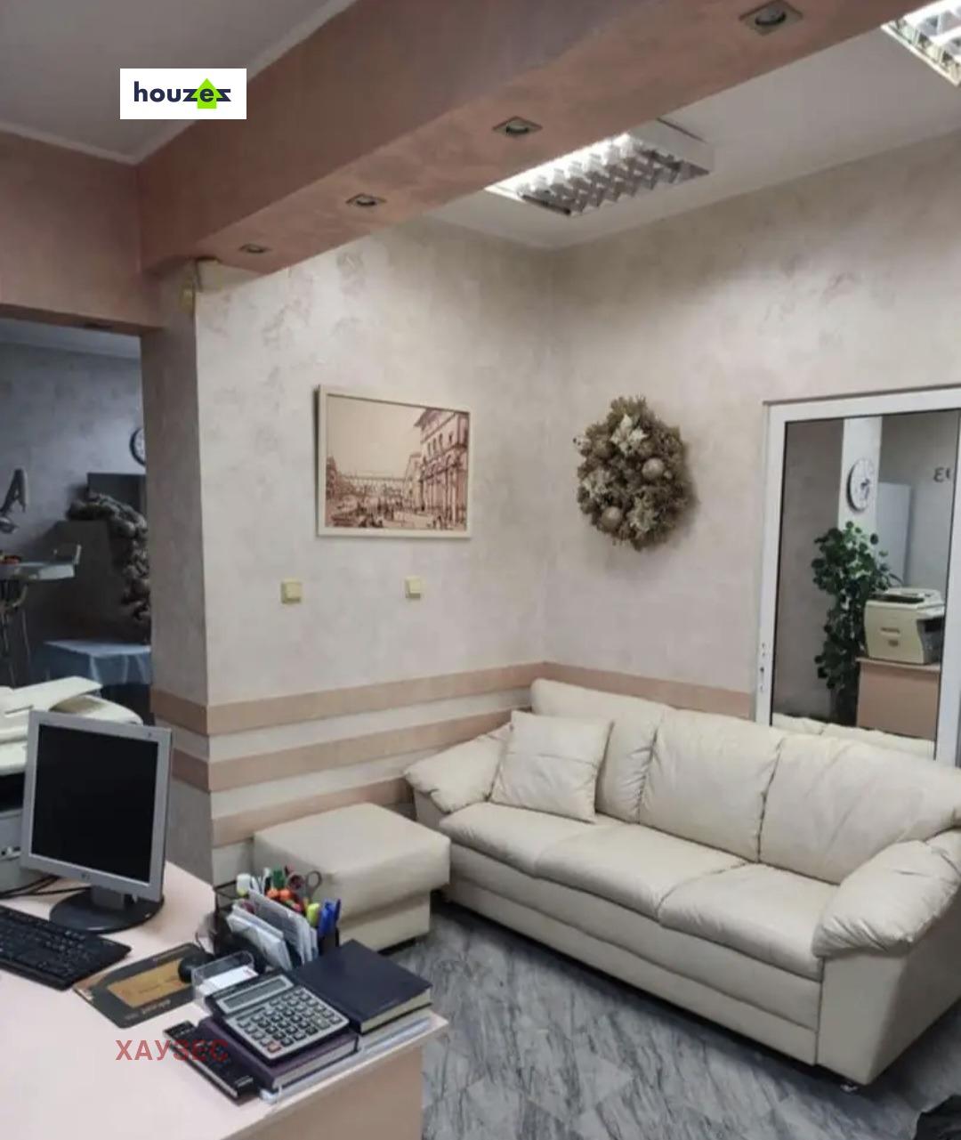 Commercial Property Sofia reception area with white leather sofa and desk